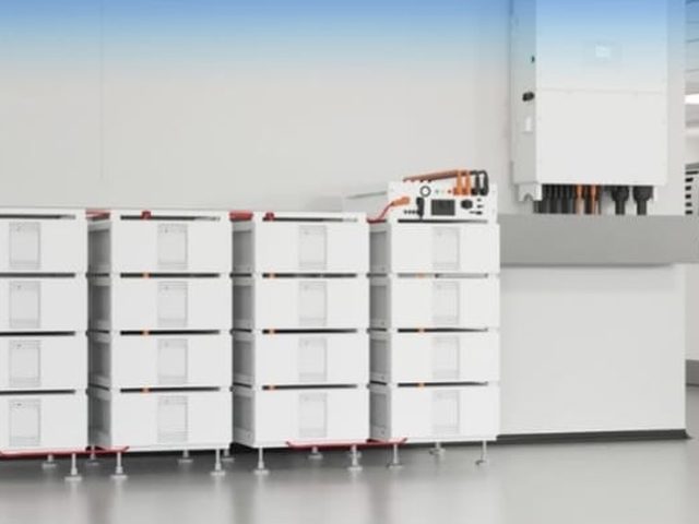 Deye commercial hybrid inverter with battery stacks in a factory